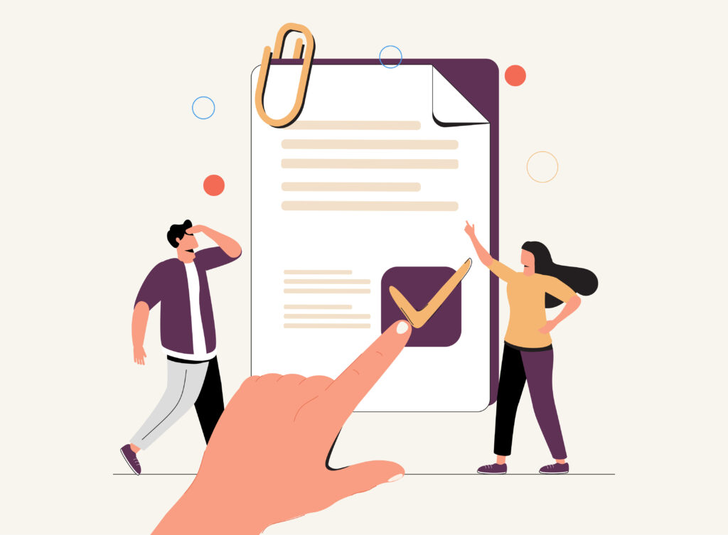 Two people looking at a document with a ticked checkbox