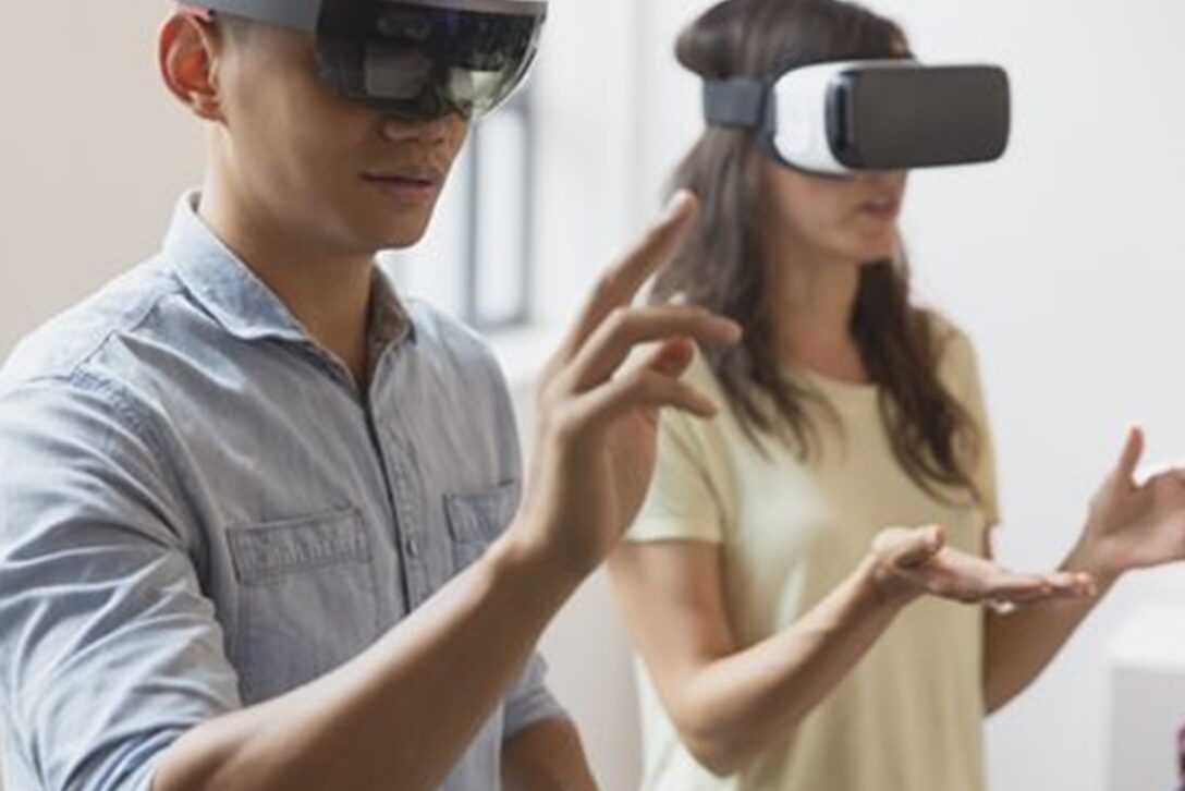 two people wearing virutal reality goggles